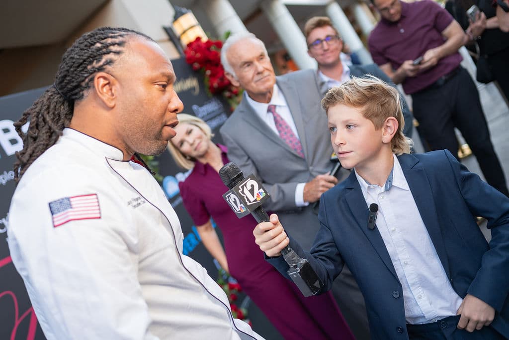 Guest interviewed on camera at the Larry Fitzgerald charity dinner in Scottsdale