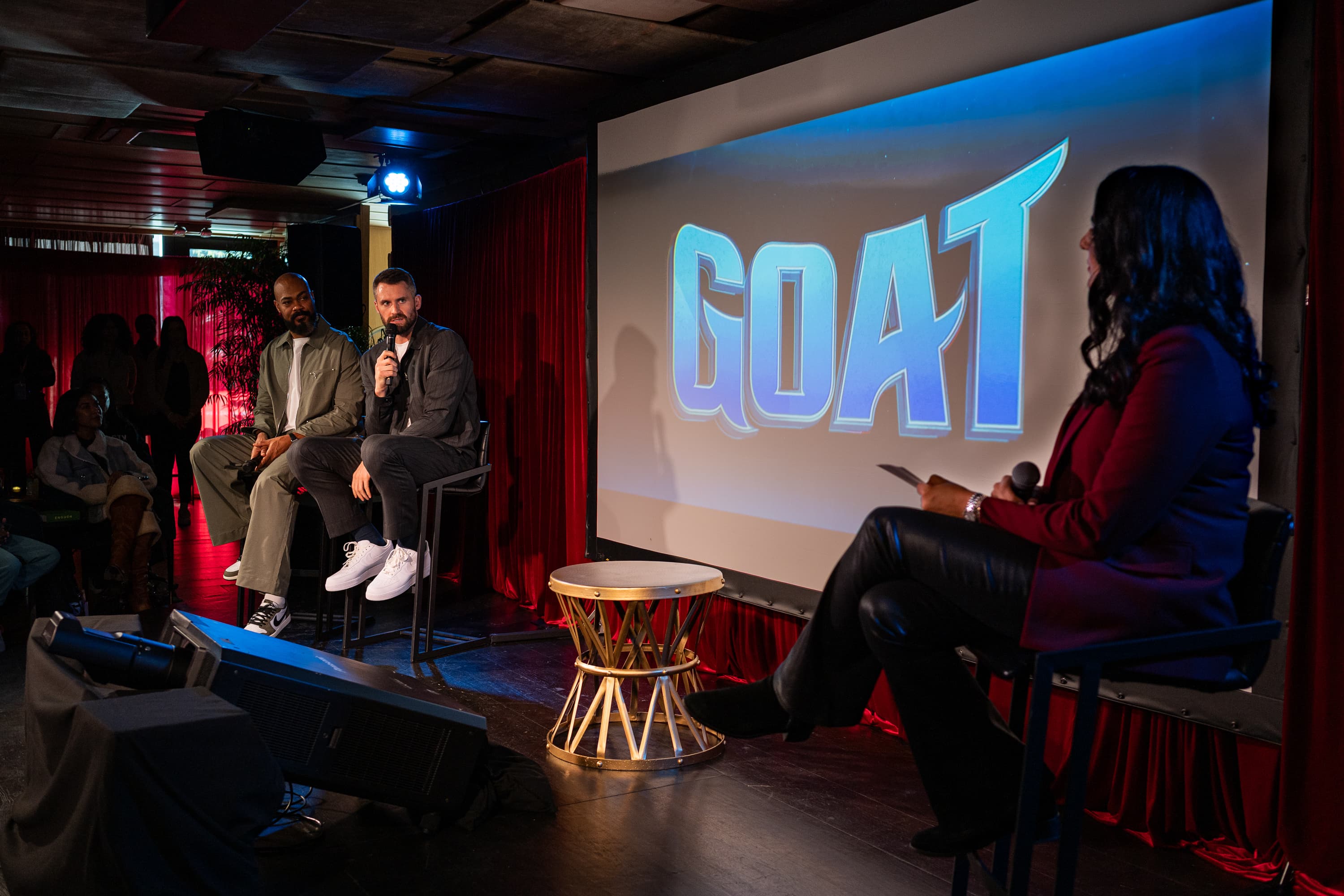 Moderated panel on a red-lit stage during NBA All-Star Weekend in Los Angeles