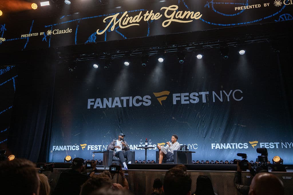 Keynote conversation on the main stage at Fanatics Fest NYC, lit against a dark arena backdrop